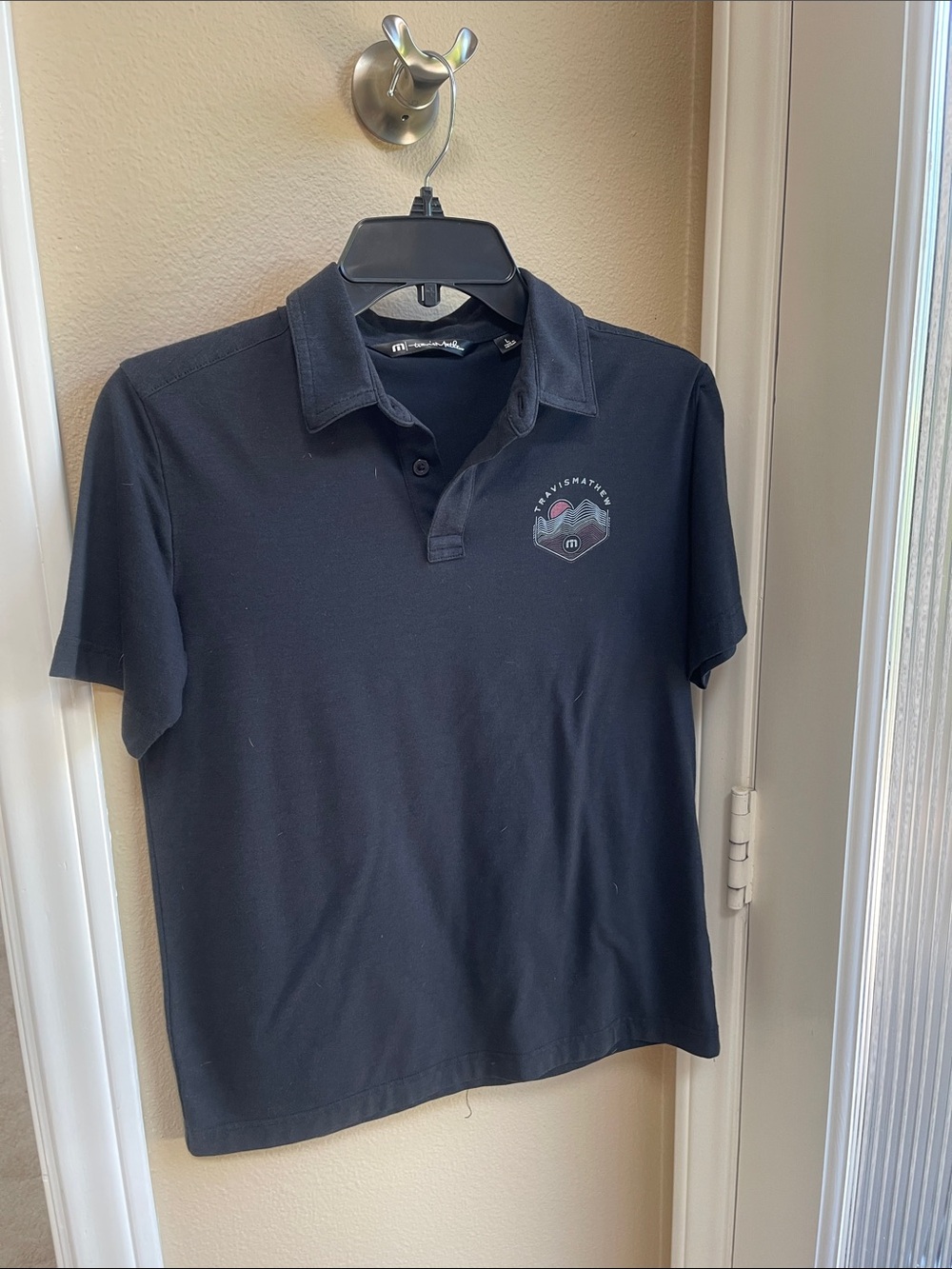 Travis Mathew Black Polo with Subtle Chest Logo